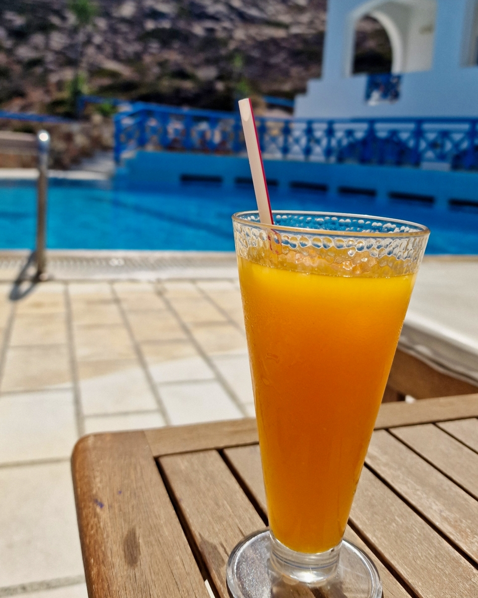 Fresh orange juice by the pool at Hotel Poseidon, Ios